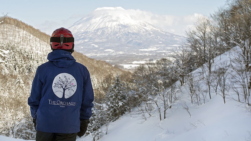Eddie snow in The Orchards jacket with Mt Yotei 1