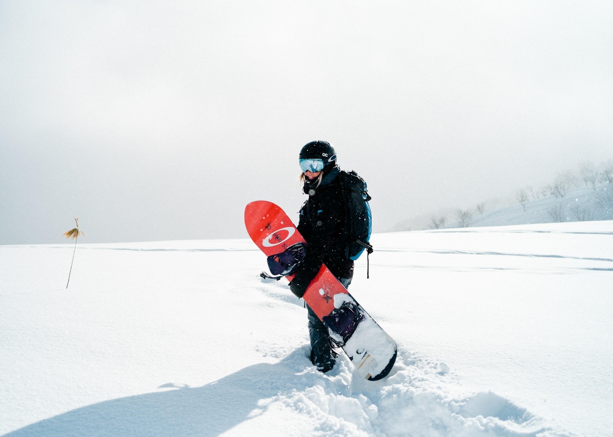 Snowboard walking unsplash